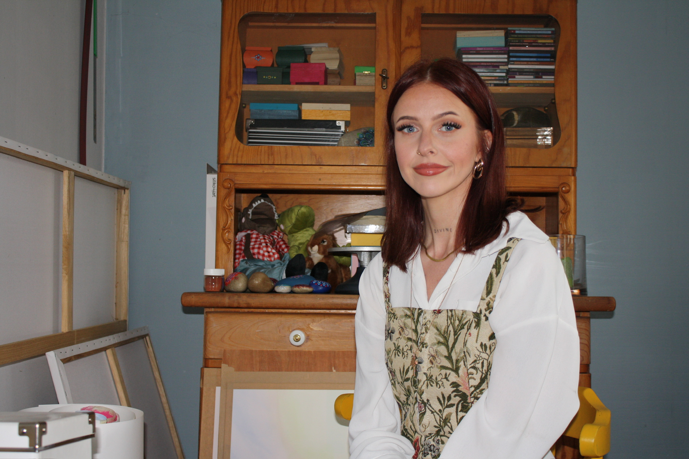Jess sitting calmly indoors with direct eye contact.